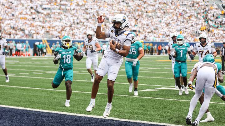 Sep 5, 2026; Morgantown, West Virginia, USA;  West Virginia Mountaineers quarterback Michael Hawkins Jr. (3) runs the ball in for a touchdown during the fourth quarter against the Coastal Carolina Chanticleers at Milan Puskar Stadium.  Mandatory Credit: Ben Queen-Imagn Images