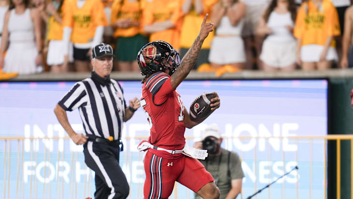 Utah Utes quarterback Byrd Ficklin (15) carries the ball for a 67-yard touchdown during the first half at McLane Stadium.