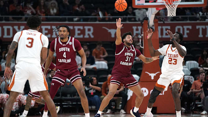 Feb 3, 2026; Austin, Texas, USA; Texas Longhorns forward Lassina Traore (23) passes the ball against South Carolina Gamecocks forward Elijah Strong (31) during the second half at Moody Center. Mandatory Credit: Dustin Safranek-Imagn Images Feb 3, 2026; Austin, Texas, USA; Texas Longhorns forward Lassina Traore (23) passes the ball against South Carolina Gamecocks forward Elijah Strong (31) during the second half at Moody Center. Mandatory Credit: Dustin Safranek-Imagn Images