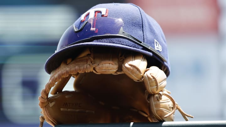 May 29, 2023; Detroit, Michigan, USA;  Texas Rangers cap and glove in the dugout in the first inning against the Detroit Tigers at Comerica Park. 