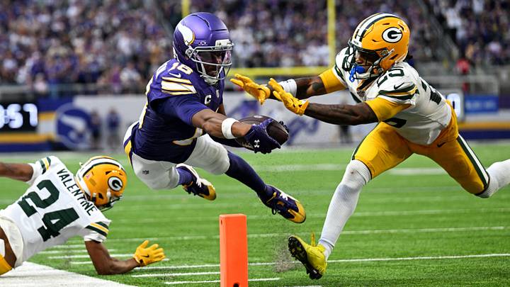 Sep 13, 2026; Minneapolis, Minnesota, USA;  Minnesota Vikings wide receiver Justin Jefferson (18) reaches for a touchdown during the second half against Green Bay Packers cornerback Keisean Nixon (25) at U.S. Bank Stadium.  Mandatory Credit: Jeffrey Becker-Imagn Images     TPX IMAGES OF THE DAY