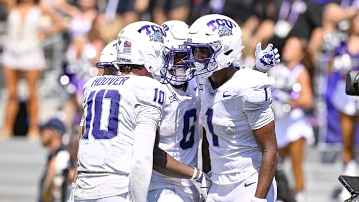 Sep 20, 2025; Fort Worth, Texas, USA; TCU Horned Frogs wide receiver Eric McAlister (1) celebrates with quarterback Josh Hoover (10) and running back Trent Battle (6) after McAlister scores a touchdown against the SMU Mustangs during the second half at Amon G. Carter Stadium. Mandatory Credit: Jerome Miron-Imagn Images