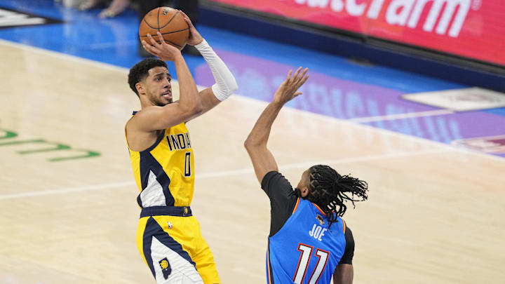 Jun 8, 2025; Oklahoma City, Oklahoma, USA; Indiana Pacers guard Tyrese Haliburton (0) shoots the ball against Oklahoma City Thunder guard Isaiah Joe (11) during the first quarter during game two of the 2025 NBA Finals at Paycom Center. Mandatory Credit: Kyle Terada-Imagn Images