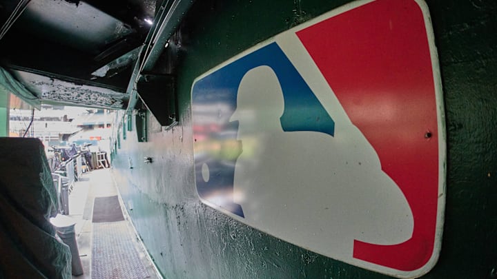 Aug 24, 2024; Oakland, California, USA; The major league baseball logo is seen on signage near the player's entrance to the field at Oakland-Alameda County Coliseum before the game between the Oakland Athletics and the Milwaukee Brewers.  Mandatory Credit: Robert Edwards-Imagn Images