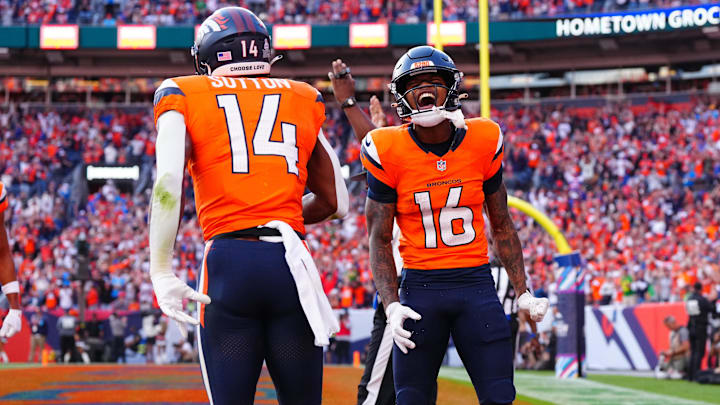 Oct 13, 2024; Denver, Colorado, USA; Denver Broncos wide receiver Troy Franklin (16) celebrates the touchdown by wide receiver Courtland Sutton (14) in the second half against the Los Angeles Chargers at Empower Field at Mile High. Oct 13, 2024; Denver, Colorado, USA; Denver Broncos wide receiver Troy Franklin (16) celebrates the touchdown by wide receiver Courtland Sutton (14) in the second half against the Los Angeles Chargers at Empower Field at Mile High.