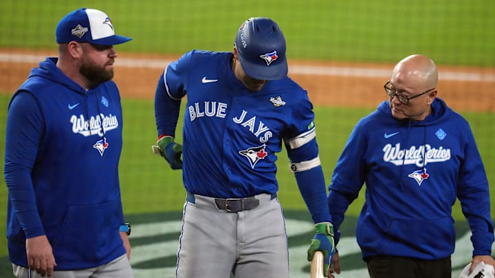 Oct 27, 2025; Los Angeles, California, USA; Toronto Blue Jays right fielder George Springer (4) leaves the game after an apparent injury in the seventh inning against the Los Angeles Dodgers during game three of the 2025 MLB World Series at Dodger Stadium. Mandatory Credit: Kirby Lee-Imagn Images Oct 27, 2025; Los Angeles, California, USA; Toronto Blue Jays right fielder George Springer (4) leaves the game after an apparent injury in the seventh inning against the Los Angeles Dodgers during game three of the 2025 MLB World Series at Dodger Stadium. Mandatory Credit: Kirby Lee-Imagn Images