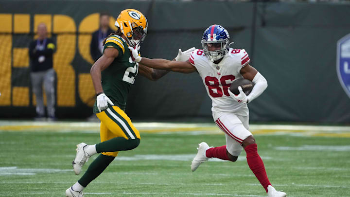 Giants receiver Darius Slayton (86) carries the ball against Green Bay Packers cornerback Eric Stokes in London.