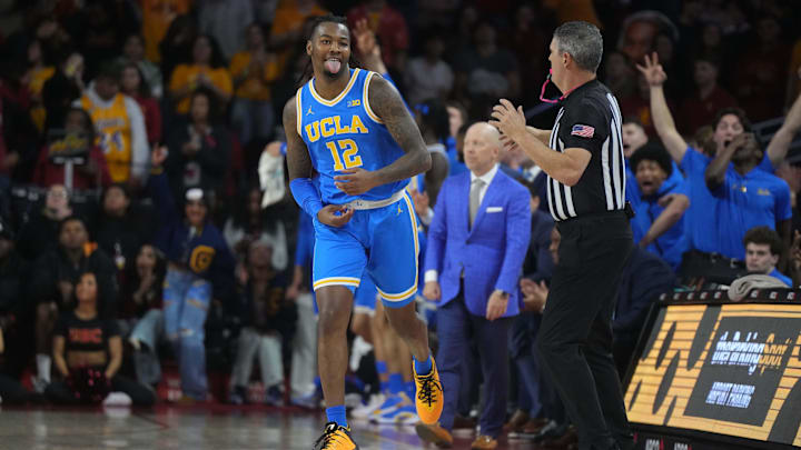 Jan 27, 2025; Los Angeles, California, USA; UCLA Bruins guard Sebastian Mack (12) celebrates after a three-point basket against the Southern California Trojans in the second half at the Galen Center. Mandatory Credit: Kirby Lee-Imagn Images