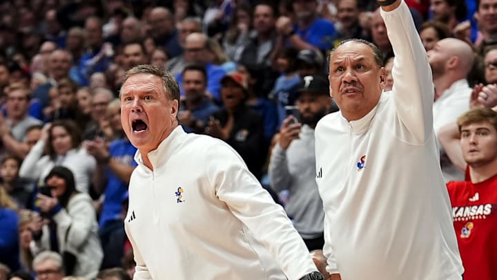 Dec 31, 2024; Lawrence, Kansas, USA; Kansas Jayhawks head coach Bill Self and assistant coach Kurt Townsend react during the second half against the West Virginia Mountaineers at Allen Fieldhouse. Mandatory Credit: Jay Biggerstaff-Imagn Images