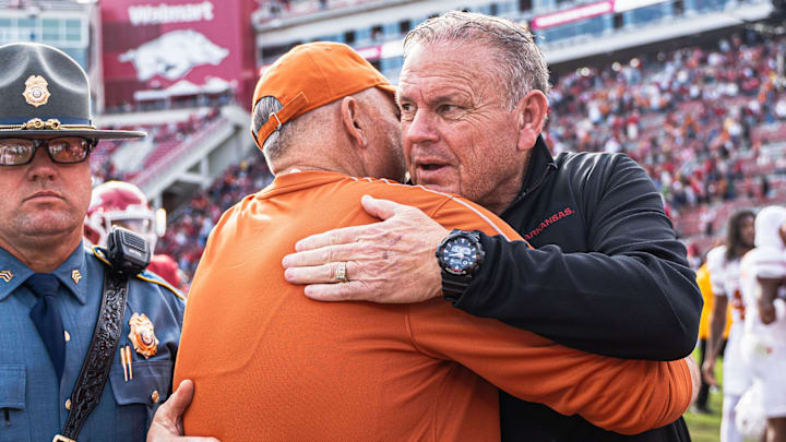 Arkansas coach Sam Pittman and Texas coach Steve Sarkisian meet postgame after the Longhorns defeat the Razorbacks 20-10