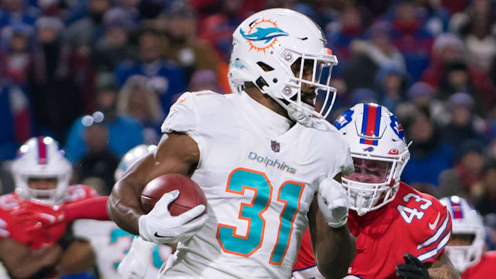 Miami Dolphins running back Raheem Mostert (31) gets past Buffalo Bills linebacker Terrel Bernard (43) on a kickoff in the first quarter at Highmark Stadium in 2022.