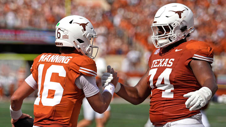Texas Longhorns quarterback Arch Manning and offensive lineman Trevor Goosby against the UTEP El Paso Miners at Darrell K Royal-Texas Memorial Stadium. 