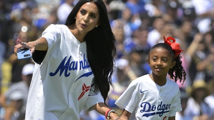 Vanessa Bryant, widow of Los Angeles Lakers Kobe Bryant, accompanies their daughter Bianka to the mound to throw out the first pitch against.