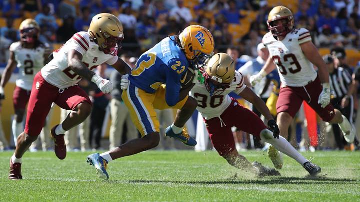 Oct 4, 2025; Pittsburgh, Pennsylvania, USA; Pittsburgh Panthers wide receiver Zion Fowler-El (23) crosses the goal line to score a touchdown against Boston College Eagles defensive backs Marcus Upton (20) and TJ Green (30) during the third quarter at Acrisure Stadium. Mandatory Credit: Charles LeClaire-Imagn Images Oct 4, 2025; Pittsburgh, Pennsylvania, USA; Pittsburgh Panthers wide receiver Zion Fowler-El (23) crosses the goal line to score a touchdown against Boston College Eagles defensive backs Marcus Upton (20) and TJ Green (30) during the third quarter at Acrisure Stadium. Mandatory Credit: Charles LeClaire-Imagn Images