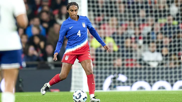 Nov 30, 2024; London, England;  United states defender Naomi Girma (4) dribbles the ball in the first half of an International friendly at Wembley Stadium. Mandatory Credit: Peter van den Berg-Imagn Images