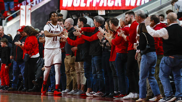 Feb 7, 2026; Raleigh, North Carolina, USA;  NC State Wolfpack guard Quadir Copeland (11) thanks the fans after the second half of the game against the Virginia Tech Hokies at Lenovo Center. Mandatory Credit: Jaylynn Nash-Imagn Images
