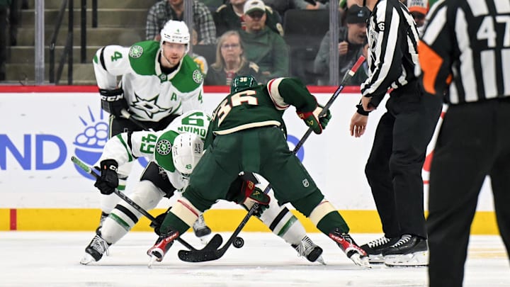 Mar 21, 2026; Saint Paul, Minnesota, USA;  Dallas Stars forward Justin Hryckowian (49) and Minnesota Wild forward Mats Zuccarello (36) face off during the third period at Grand Casino Arena. Mandatory Credit: Nick Wosika-Imagn Images