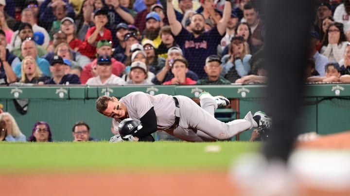 Jun 16, 2024; Boston, Massachusetts, USA; New York Yankees first baseman Anthony Rizzo (48) trips on Boston Red Sox pitcher Brennan Bernardino (not pictured) and rolls on the ground during the seventh inning at Fenway Park. Mandatory Credit: Eric Canha-USA TODAY Sports Jun 16, 2024; Boston, Massachusetts, USA; New York Yankees first baseman Anthony Rizzo (48) trips on Boston Red Sox pitcher Brennan Bernardino (not pictured) and rolls on the ground during the seventh inning at Fenway Park. Mandatory Credit: Eric Canha-USA TODAY Sports