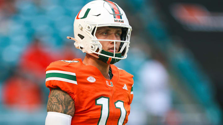 Miami Hurricanes quarterback Carson Beck (11) warms up before a game against the South Florida Bulls at Hard Rock Stadium.