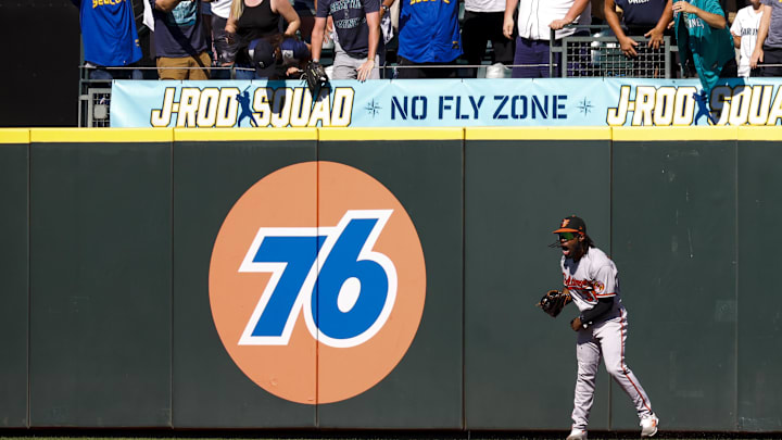 Cedric Mullins celebrates after robbing Ty France of a game-tying home run