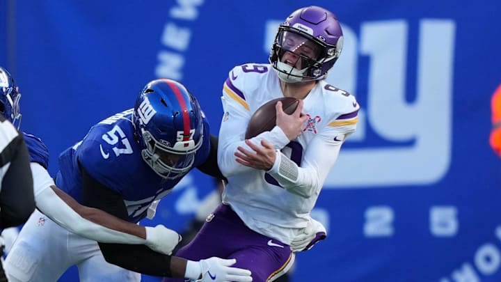 Dec 21, 2025; East Rutherford, New Jersey, USA; New York Giants defensive end Chauncey Golston (57) sacks Minnesota Vikings quarterback J.J. McCarthy (9) during the first half at MetLife Stadium. Mandatory Credit: Robert Deutsch-Imagn Images