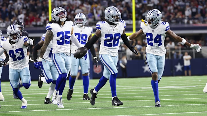 Dallas Cowboys safety Malik Hooker celebrates with teammates after making an interception during the first quarter against the Houston Texans.