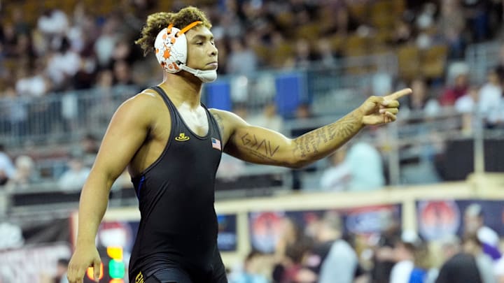 Stillwater's Ladarion Lockett celebrates his win over Sand Springs' Jakoby Petree in the Class 6A 175-pound semifinal match during the semifinals of the Oklahoma State high high school wrestling championship tournament at the State Fair Arena in Oklahoma City, Friday, Feb., 28, 2025.