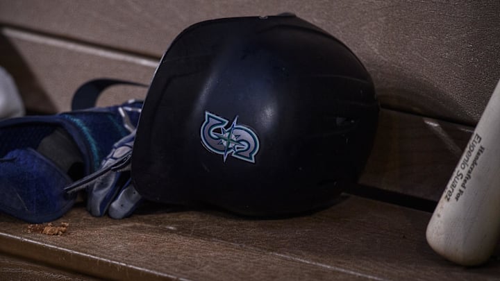 A Seattle Mariners helmet is pictured in the dugout during a game against the Texas Rangers on June 5, 2022, at Globe Life Field. A Seattle Mariners helmet is pictured in the dugout during a game against the Texas Rangers on June 5, 2022, at Globe Life Field.