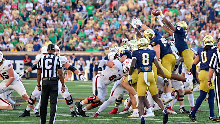 Sep 21, 2024; South Bend, Indiana, USA; Notre Dame Fighting Irish defensive lineman Bryce Young (30) blocks a field goal attempt by the Miami Redhawks in the fourth quarter at Notre Dame Stadium. Mandatory Credit: Matt Cashore-Imagn Images