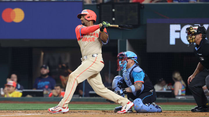 Jul 16, 2024; Arlington, Texas, USA; American League second baseman Marcus Semien of the Texas Rangers (2)  hits a single in the third inning against the National League during the 2024 MLB All-Star game at Globe Life Field. Mandatory Credit: Kevin Jairaj-USA TODAY Sports