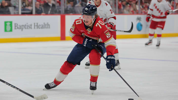 Nov 30, 2024; Sunrise, Florida, USA; Florida Panthers center Jesper Boqvist (70) moves the puck against the Carolina Hurricanes during the second period at Amerant Bank Arena. Mandatory Credit: Sam Navarro-Imagn Images Nov 30, 2024; Sunrise, Florida, USA; Florida Panthers center Jesper Boqvist (70) moves the puck against the Carolina Hurricanes during the second period at Amerant Bank Arena. Mandatory Credit: Sam Navarro-Imagn Images