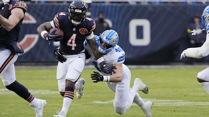 D'Andre Swift drives ahead for yardage against Detroit in the regular-season finale.