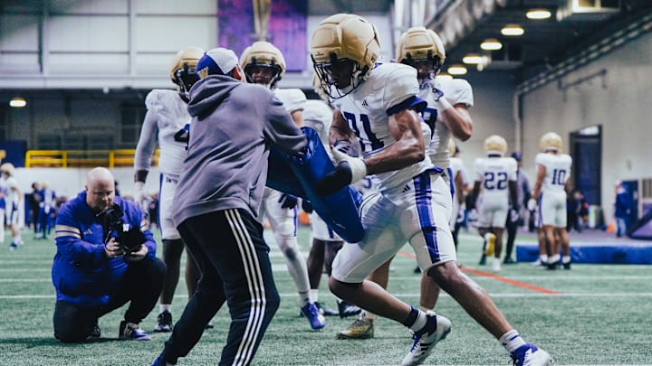 Isaiah Ward goes through a spring pass-rush drill. 