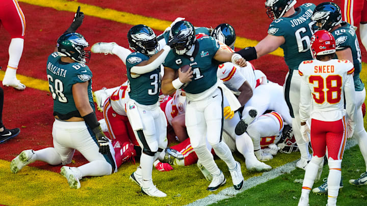 Philadelphia Eagles quarterback Jalen Hurts (1) celebrates scoring a touchdown on a quarterback sneak against the Kansas City Chiefs during the first quarter in Super Bowl LVII at State Farm Stadium in Glendale on Feb. 12, 2023.