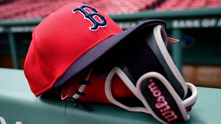 May 18, 2025; Boston, Massachusetts, USA; A Boston Red Sox hat and glove rests on the railing by the dugout prior to a game against the Atlanta Braves at Fenway Park. Mandatory Credit: Bob DeChiara-Imagn Images May 18, 2025; Boston, Massachusetts, USA; A Boston Red Sox hat and glove rests on the railing by the dugout prior to a game against the Atlanta Braves at Fenway Park. Mandatory Credit: Bob DeChiara-Imagn Images