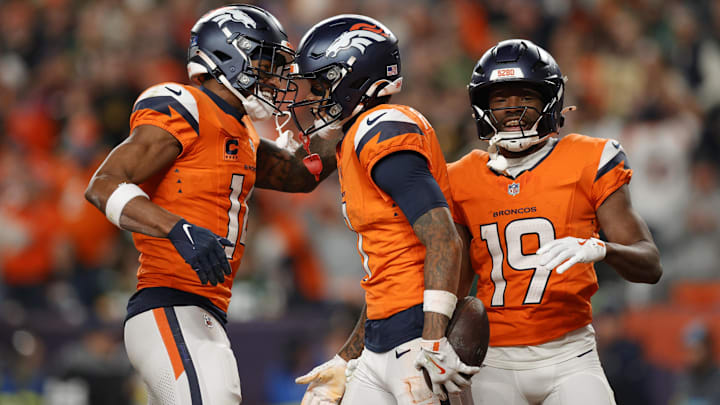 Dec 14, 2025; Denver, Colorado, USA; Denver Broncos wide receiver Troy Franklin (11), wide receiver Courtland Sutton (14) and wide receiver Marvin Mims Jr. (19) celebrate a touchdown during the third quarter against the Green Bay Packers at Empower Field at Mile High. Mandatory Credit: Isaiah J. Downing-Imagn Images