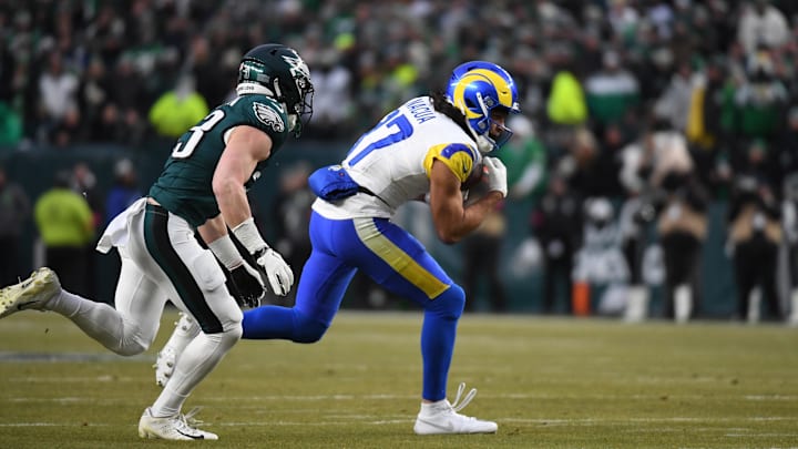 Jan 19, 2025; Philadelphia, Pennsylvania, USA; Los Angeles Rams wide receiver Puka Nacua (17) runs with the ball against the Philadelphia Eagles in a 2025 NFC divisional round game at Lincoln Financial Field. Mandatory Credit: Eric Hartline-Imagn Images