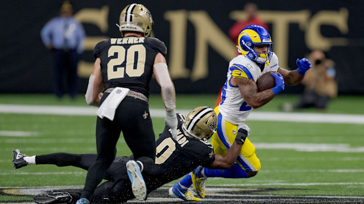 Los Angeles Rams running back Kyren Williams (23) is tackled by New Orleans Saints safety Ugo Amadi (0)