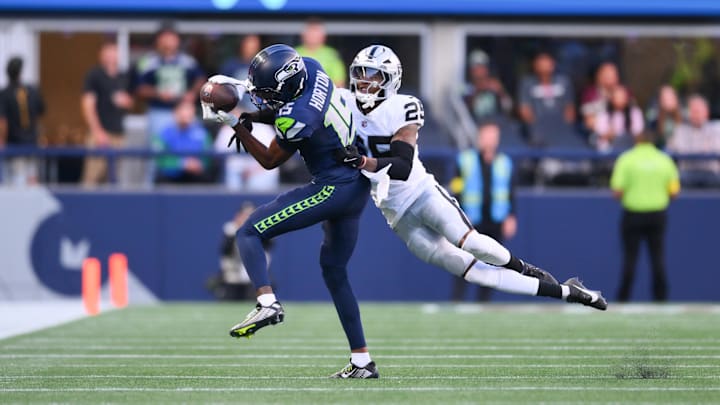 Seattle Seahawks wide receiver Tory Horton (15) catches a pass while covered by Las Vegas Raiders cornerback Decamerion Richardson (25) during the first half at Lumen Field. Seattle Seahawks wide receiver Tory Horton (15) catches a pass while covered by Las Vegas Raiders cornerback Decamerion Richardson (25) during the first half at Lumen Field.