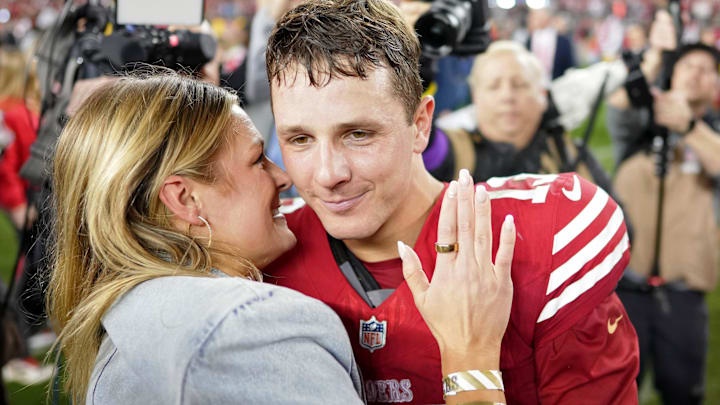 San Francisco 49ers quarterback Brock Purdy (13) kisses his fiance Jenna Brandt after winning the NFC Championship football game against the Detroit Lions at Levi's Stadium. San Francisco 49ers quarterback Brock Purdy (13) kisses his fiance Jenna Brandt after winning the NFC Championship football game against the Detroit Lions at Levi's Stadium.