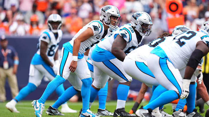 Oct 27, 2024; Denver, Colorado, USA; Carolina Panthers quarterback Bryce Young (9) at the line of scrimmage in the first half against the Denver Broncos at Empower Field at Mile High.