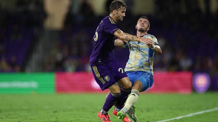 Oct 2, 2024; Orlando, Florida, USA; Orlando City defender Michael Halliday (26) and Philadelphia Union defender Kai Wagner (27) collide in the second half at Inter&Co Stadium. Mandatory Credit: Nathan Ray Seebeck-Imagn Images