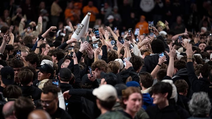 Vanderbilt fans storm the court to celebrate their Commodores win over the Tennessee Volunteers after their game at Memorial Gym in Nashville, Tenn., Saturday, Jan. 18, 2025.
