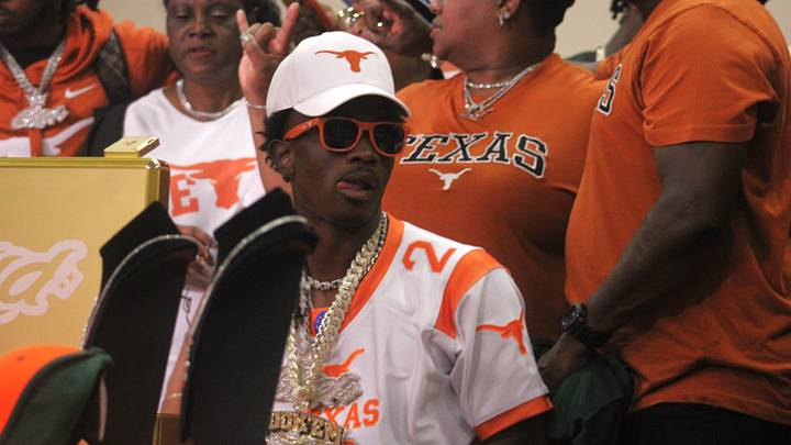 Surrounded by family and friends, Mandarin receiver Jaime Ffrench Jr. smiles while wearing his University of Texas chain following his college commitment on August 30, 2024. [Clayton Freeman/Florida Times-Union]
