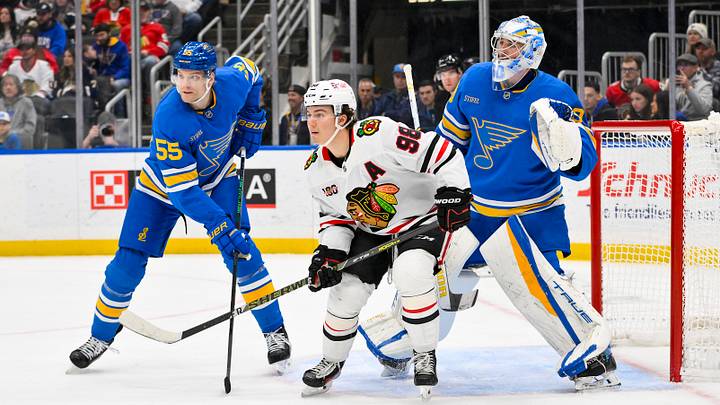 Dec 12, 2025; St. Louis, Missouri, USA; St. Louis Blues goaltender Joel Hofer (30) and defenseman Colton Parayko (55) defend the net against Chicago Blackhawks center Connor Bedard (98) during the third period at Enterprise Center. Mandatory Credit: Jeff Curry-Imagn Images