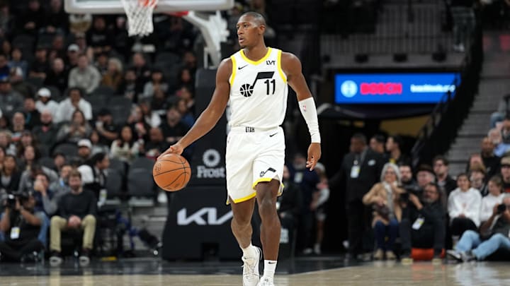 Dec 26, 2023; San Antonio, Texas, USA; Utah Jazz guard Kris Dunn (11) dribbles the ball in the first