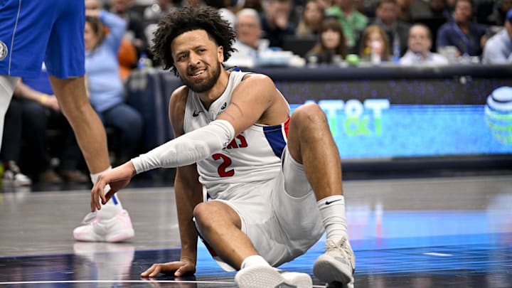 Mar 21, 2025; Dallas, Texas, USA; Detroit Pistons guard Cade Cunningham (2) reacts to being knocked to the floor during the second half against the Dallas Mavericks at the American Airlines Center. Mandatory Credit: Jerome Miron-Imagn Images