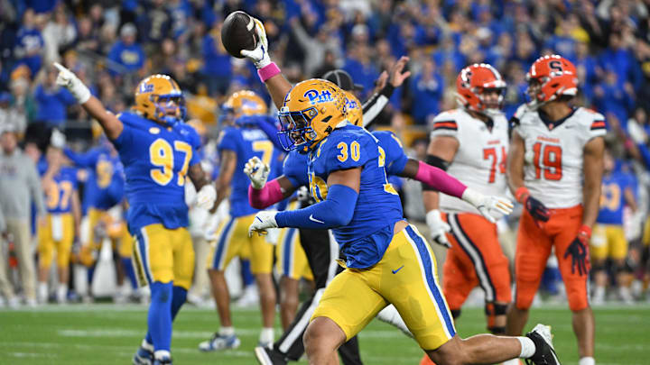 Oct 24, 2024; Pittsburgh, Pennsylvania, USA; Pittsburgh Panthers linebacker Brandon George (30) celebrates and interception against the Syracuse Orange during the first quarter  at Acrisure Stadium. Mandatory Credit: Barry Reeger-Imagn Images