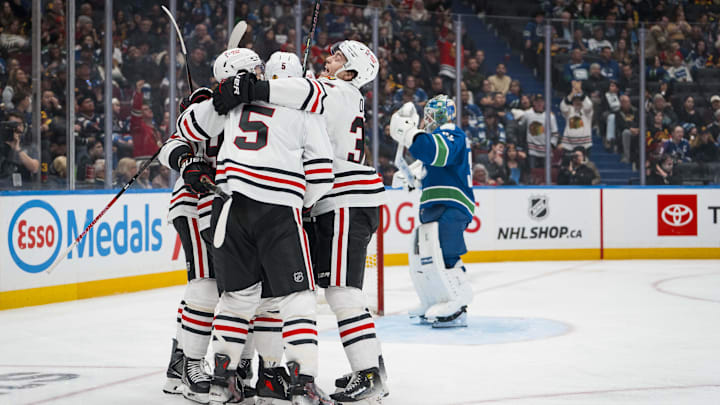 Nov 5, 2025; Vancouver, British Columbia, CAN; Chicago Blackhawks forward Tyler Bertuzzi (59) and defenseman Connor Murphy (5) and forward Colton Dach (34) celebrate Bertuzzi’s first goal of the third period against the Vancouver Canucks at Rogers Arena. Mandatory Credit: Bob Frid-Imagn Images Nov 5, 2025; Vancouver, British Columbia, CAN; Chicago Blackhawks forward Tyler Bertuzzi (59) and defenseman Connor Murphy (5) and forward Colton Dach (34) celebrate Bertuzzi’s first goal of the third period against the Vancouver Canucks at Rogers Arena. Mandatory Credit: Bob Frid-Imagn Images