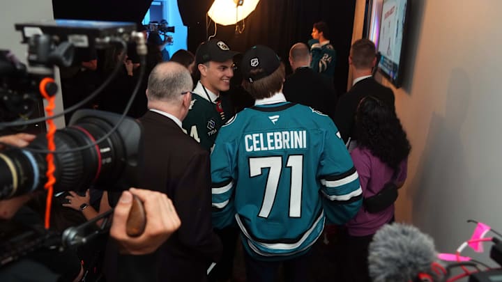 Jun 28, 2024; Las Vegas, Nevada, USA; San Jose Sharks 1st overall pick Macklin Celebrini talks with Minnesota Wild 1st round pick Zeev Buium in the first round of the 2024 NHL Draft at The Sphere. Mandatory Credit: Joe Camporeale-Imagn Images